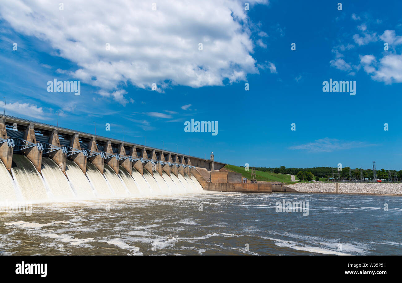 Water flowing through the open gates of a hydro electric power station Stock Photo
