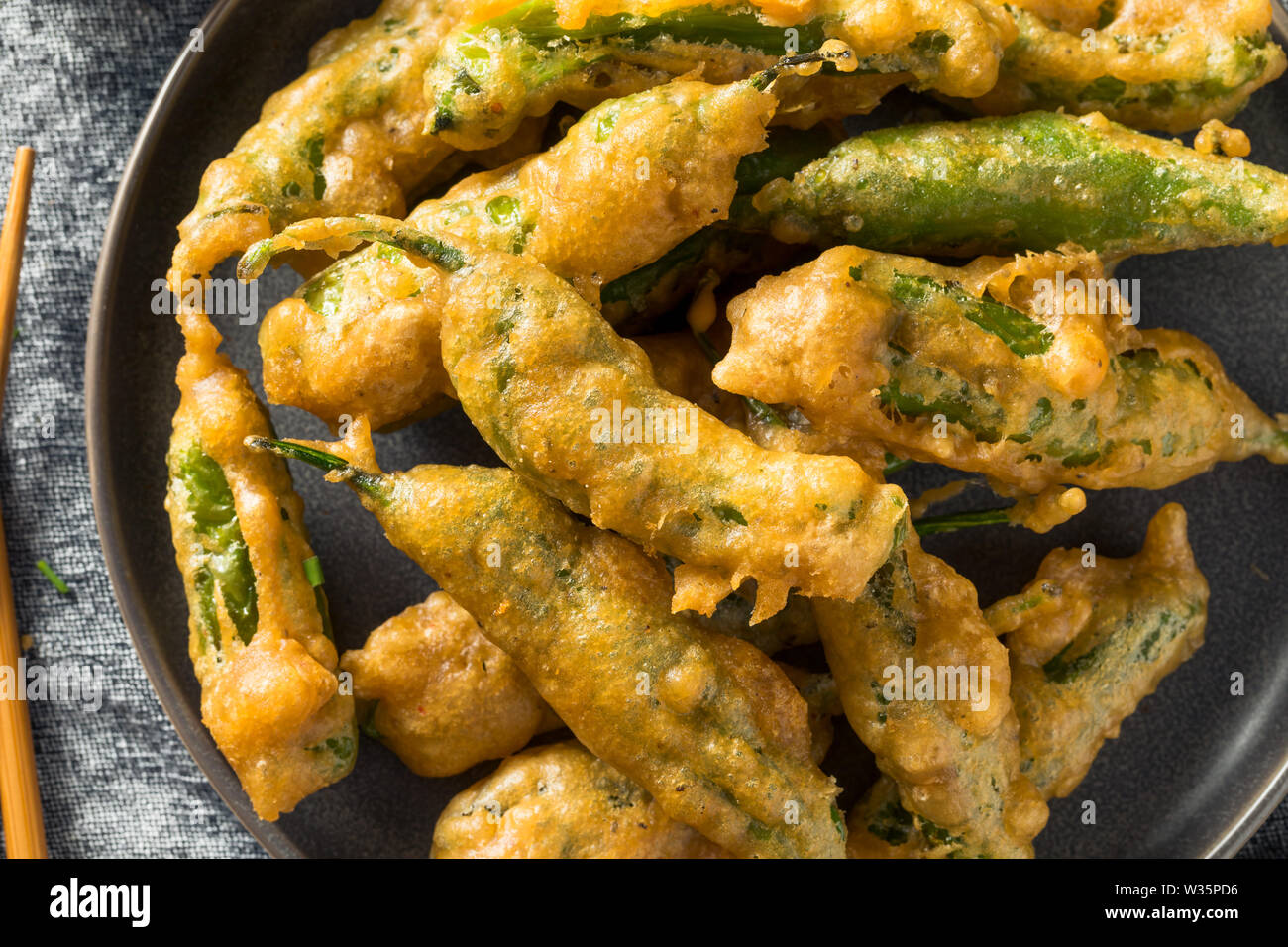 Homemade Deep Fried Shishito Peppers with Sauce Stock Photo