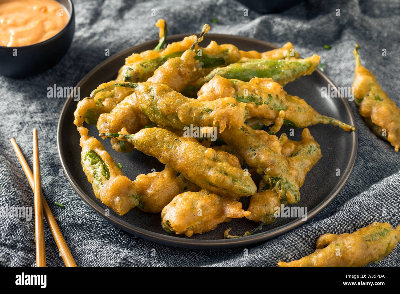 Homemade Deep Fried Shishito Peppers with Sauce Stock Photo