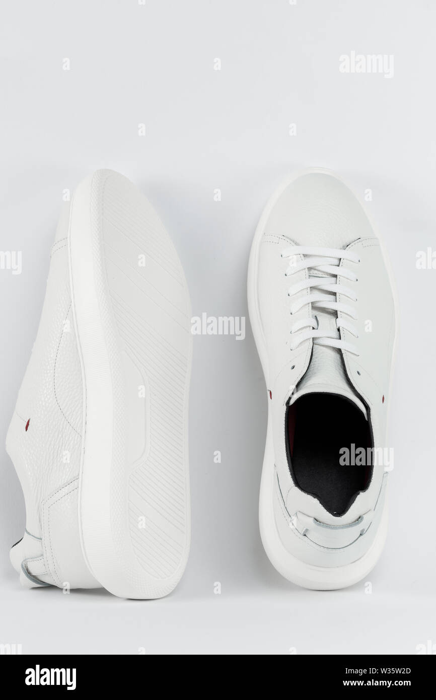 New white sneakers Men's sport shoes, close up Stock Photo Alamy