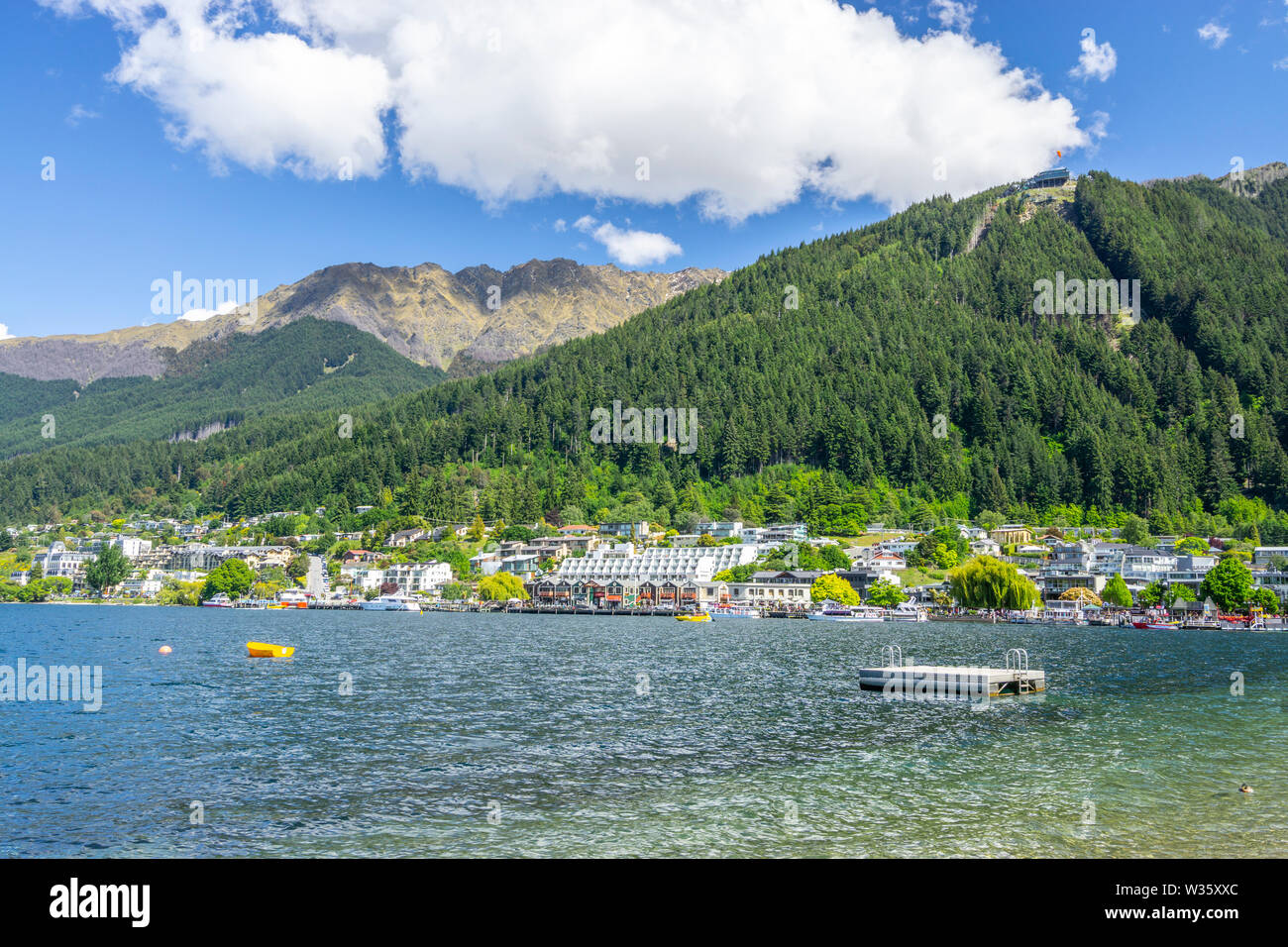 View of shoreline and town beach of Lake Wakatipu in Queenstown on ...