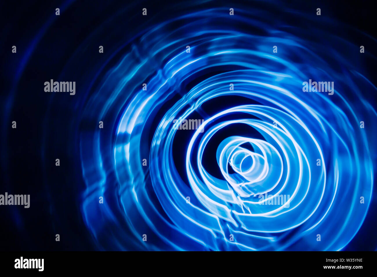 Sound waves in the dark. Blue color Stock Photo