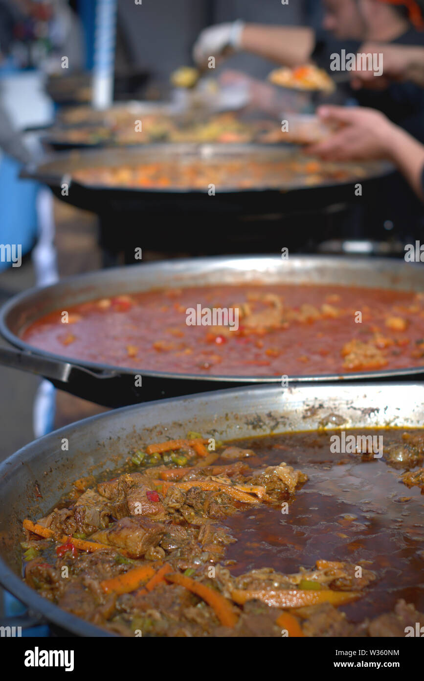 Several large casseroles of different types of locro, a typical argentinian stew Stock Photo