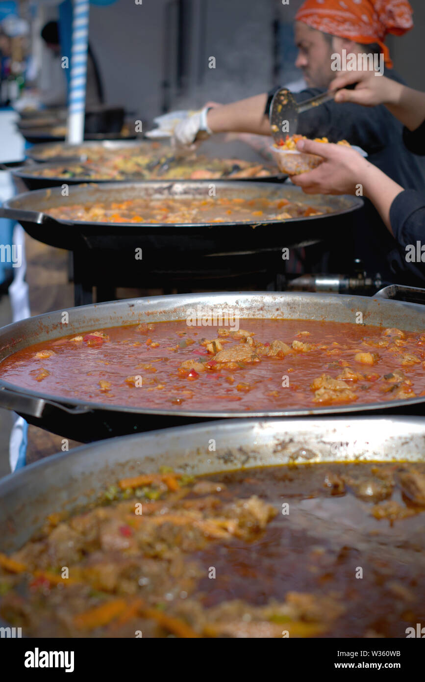 Large casseroles of "Locro", a traditional argentinian stew, made from corn and white haricot Stock Photo