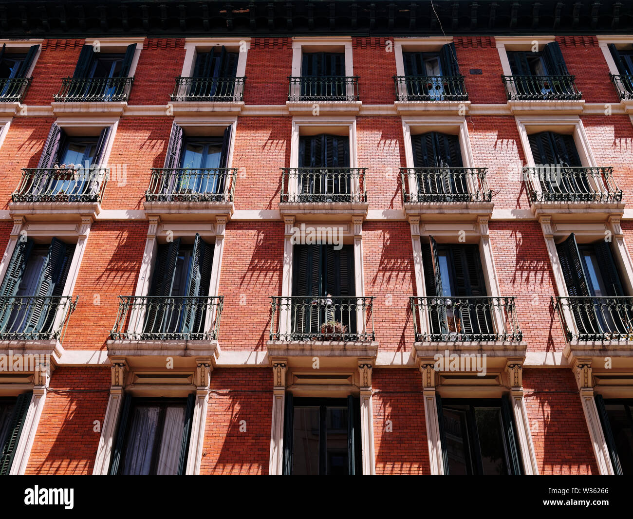 Facade of an apartment building with windows and balconies Stock Photo