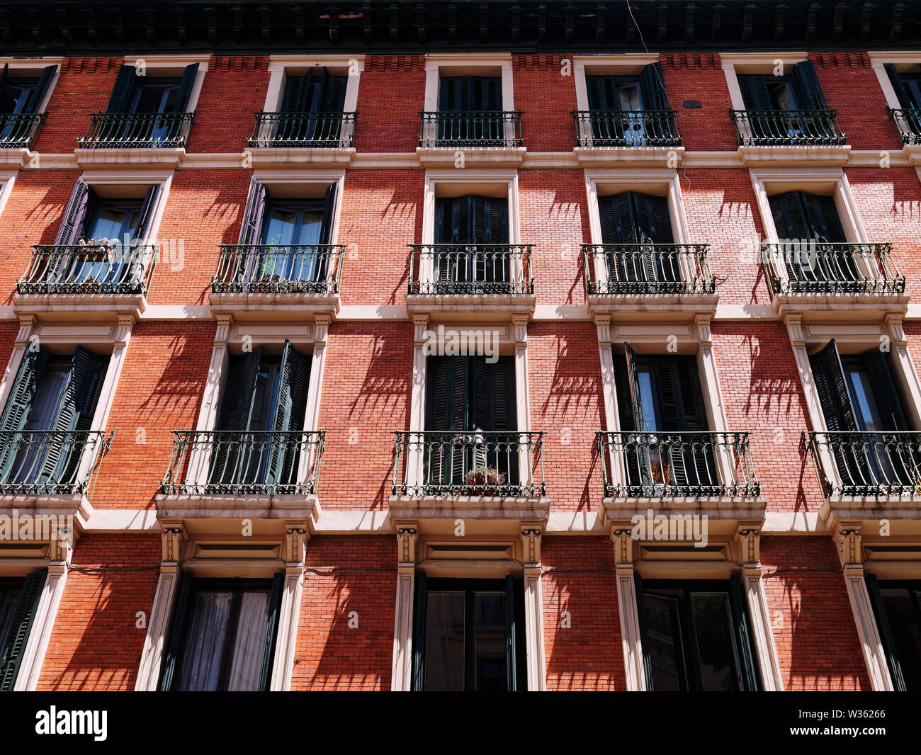 Facade of an apartment building with windows and balconies Stock Photo ...