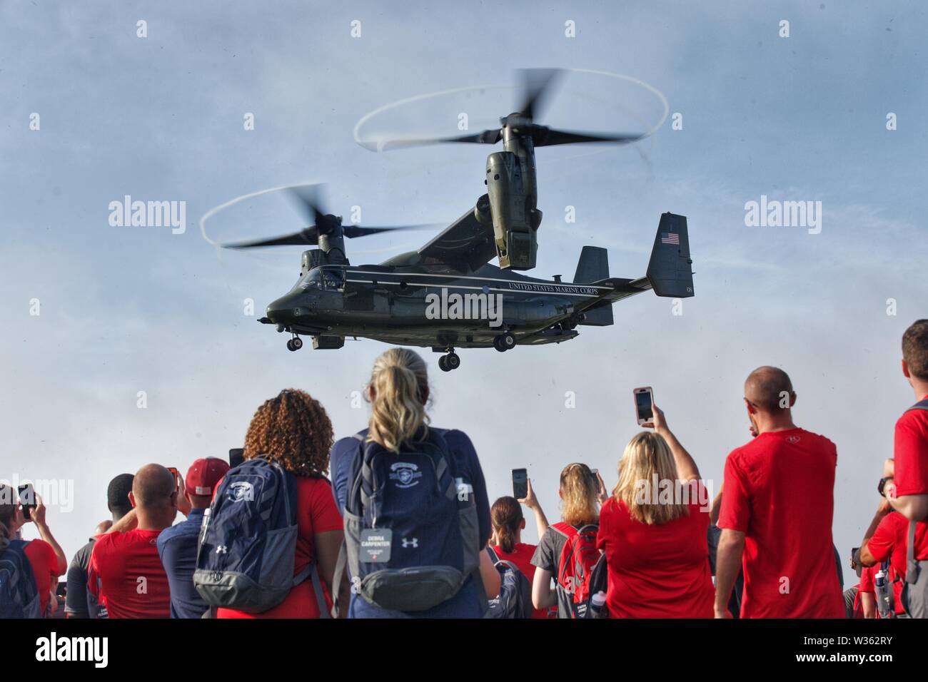 An MV-22 Osprey assigned to Marine Helicopter Squadron One lands at Camp Barrett during the Battles Won Academy at Marine Corps Base Quantico, Virginia, July 12, 2019. The Battles Won Academy is a part of the Marine Corps’ Semper Fidelis All-American Program, which recognizes young men and women who excel in athletics, but have also shown themselves to be leaders in the classroom and in their communities. Nearly 100 high school student-athletes were selected to attend the academy, which runs through July 14 and focuses on developing their self-confidence, discipline, teamwork, and honing the f Stock Photo