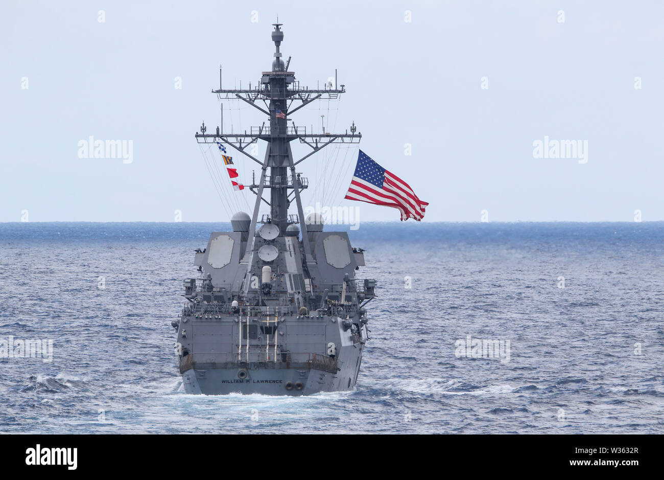 190711-N-DX072-1002 TASMAN SEA (July 11, 2019) The U.S. Navy Arleigh Burke-class guided-missile destroyer USS William P. Lawrence (DDG 110) transits with the amphibious transport dock ship USS Green Bay (LPD 20) in a photo exercise (PHOTOEX) during Talisman Sabre 2019. Green Bay, part of the Wasp Expeditionary Strike Group, with embarked 31st Marine Expeditionary Unit, is currently participating in Talisman Sabre 2019 off the coast of Northern Australia. A bilateral, biennial event, Talisman Sabre is designed to improve U.S. and Australian combat training, readiness and interoperability throug Stock Photo