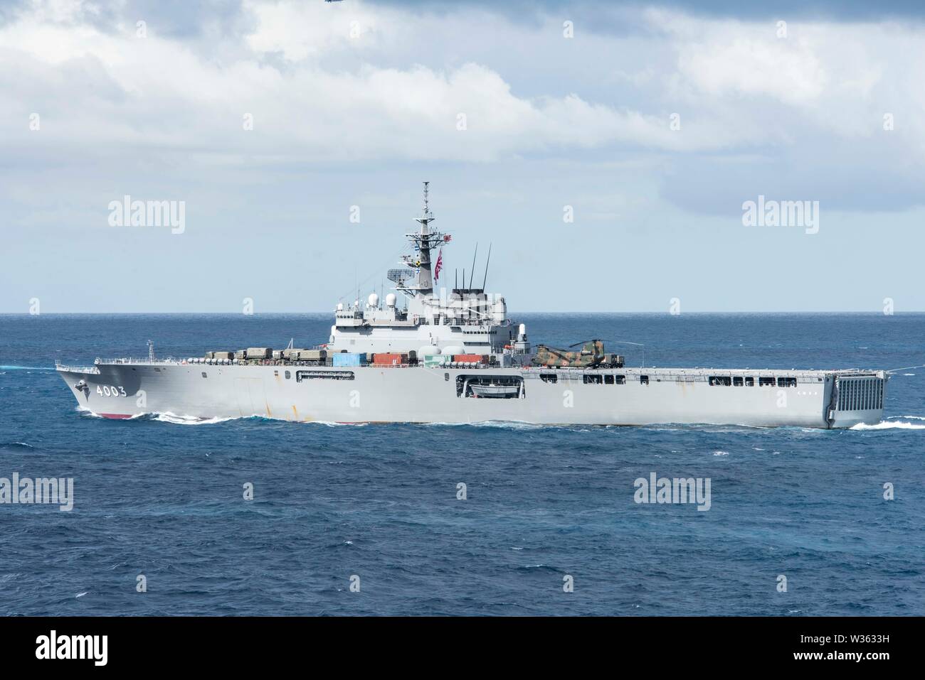 190711-N-DX072-1047 TASMAN SEA (July 11, 2019) The Japan Maritime Self-Defense Force Ōsumi-class amphibious transport dock ship JS Kunisaki (LST 4003) transits with the amphibious transport dock ship USS Green Bay (LPD 20) in a photo exercise (PHOTOEX) during Talisman Sabre 2019. Green Bay, part of the Wasp Expeditionary Strike Group, with embarked 31st Marine Expeditionary Unit, is currently participating in Talisman Sabre 2019 off the coast of Northern Australia. A bilateral, biennial event, Talisman Sabre is designed to improve U.S. and Australian combat training, readiness and interoperabi Stock Photo