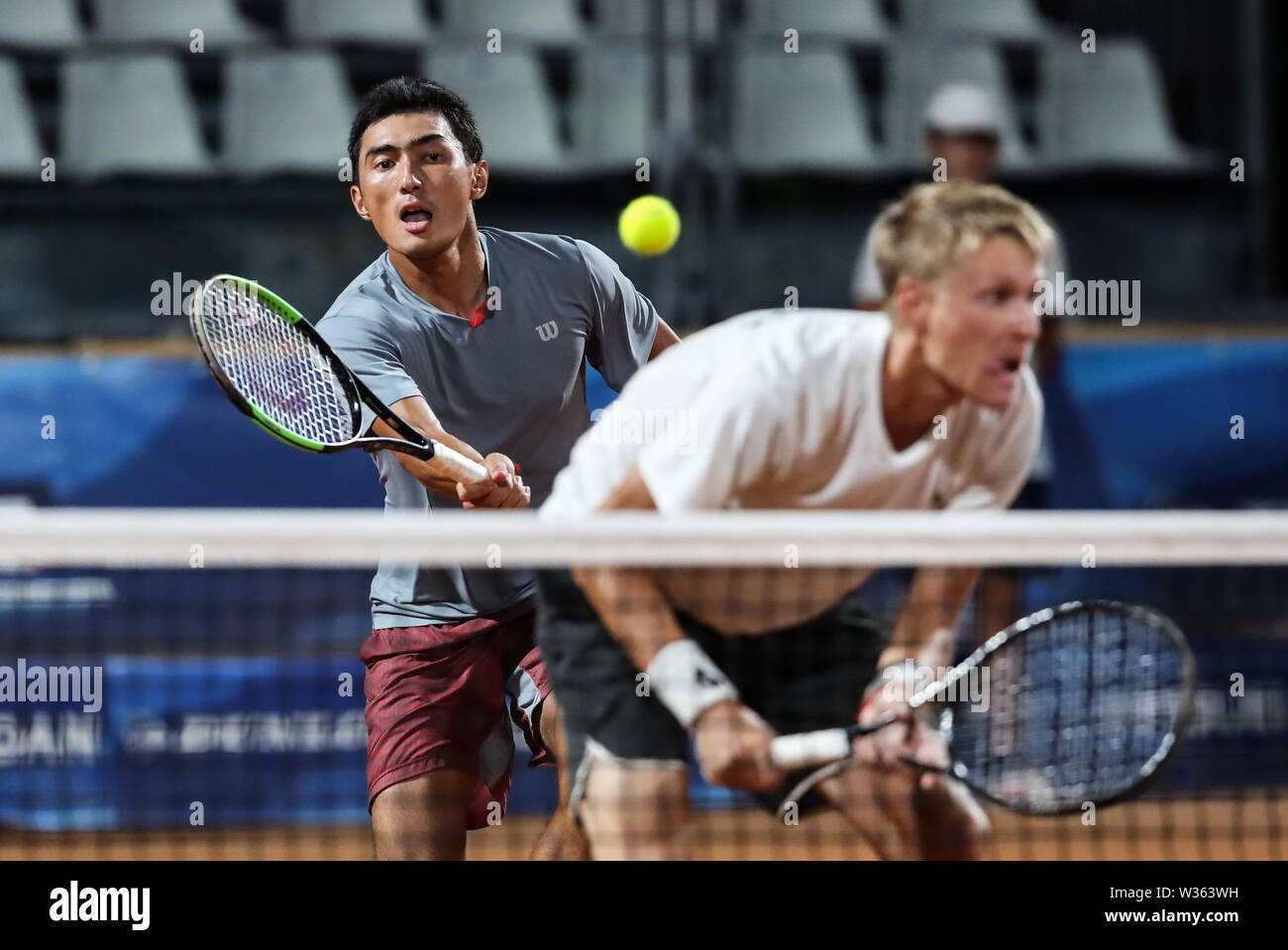 Naples, Italy. 12th July, 2019. Sanjar Fayziev/Khumoyun Sultanov (L) of  Uzbekistan compete during the men's doubles final match between Sanjar  Fayziev/Khumoyun Sultanov of Uzbekistan and Hong Seongchan/Shin Sanhui of  South Korea at