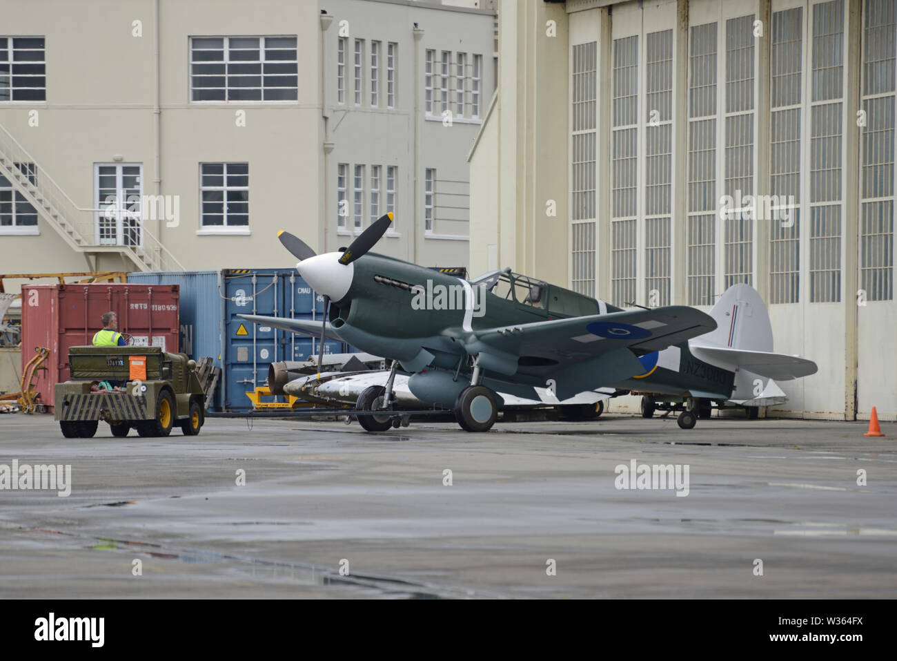 CHRISTCURCH, NEW ZEALAND, DECEMBER 12, 2018: Engineers at the Air Force Museum shift a 1941 Kittyhawk to another hangar for safekeeping. Stock Photo