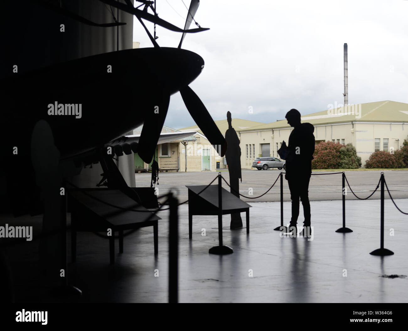 CHRISTCURCH, NEW ZEALAND, DECEMBER 12, 2018: Silhouette of an unknown visitor to the Air Froce Museum. Stock Photo