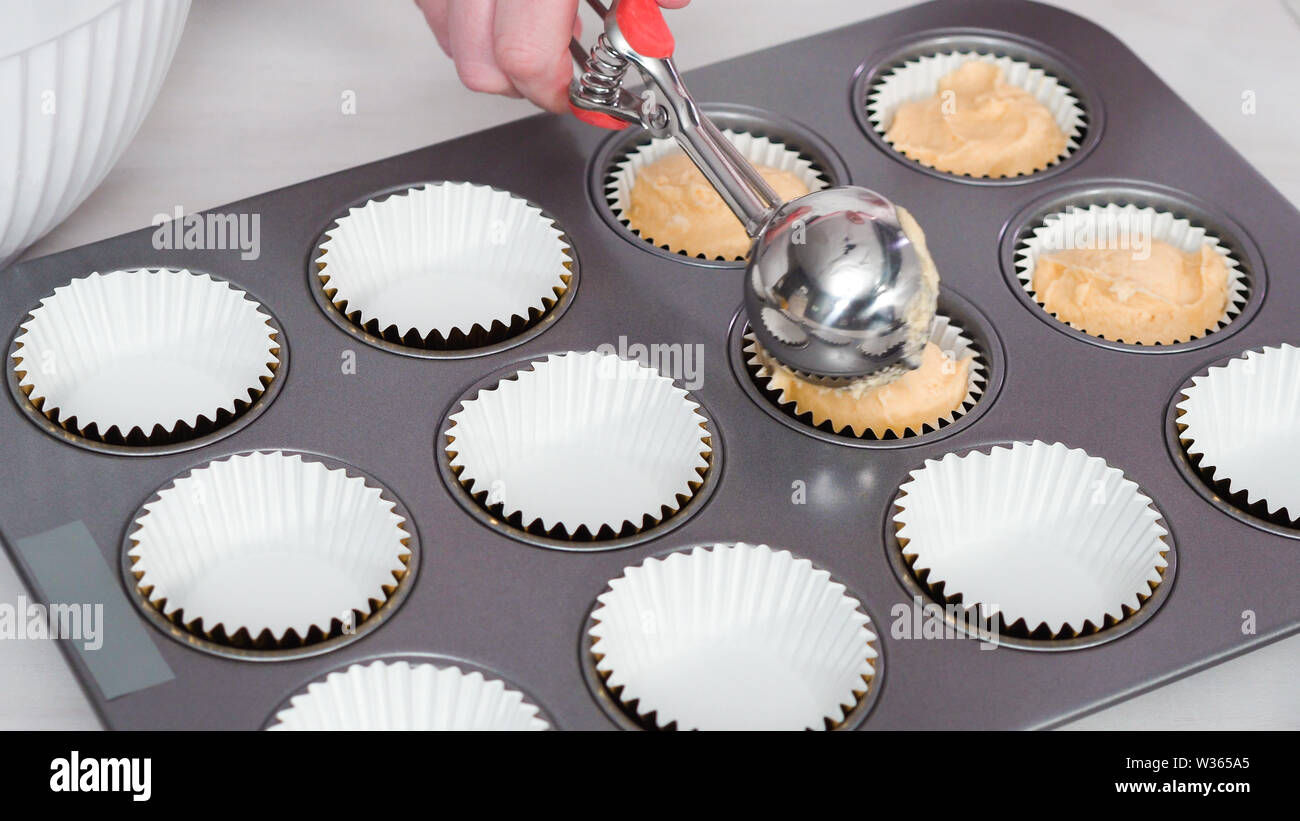 https://c8.alamy.com/comp/W365A5/step-by-step-scooping-cupcake-batter-into-cupcake-liners-to-bake-vanilla-cupcakes-W365A5.jpg