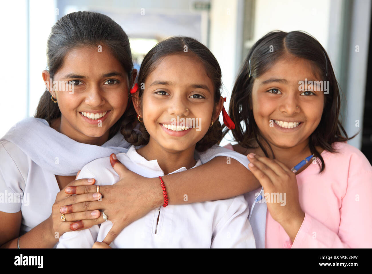 Schoolgirls smiling in a school Stock Photo - Alamy