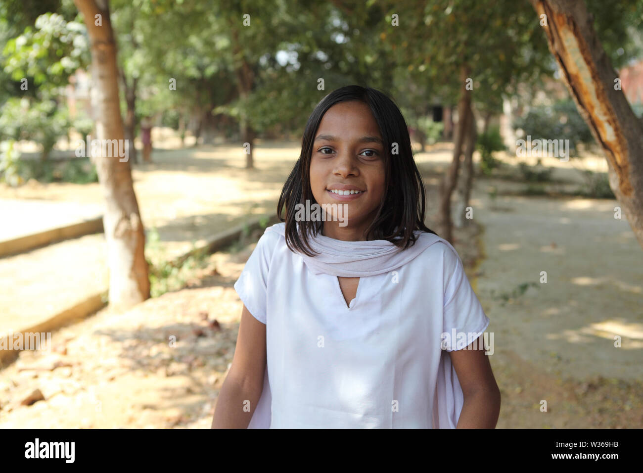 Portrait of a schoolgirl smiling Stock Photo - Alamy