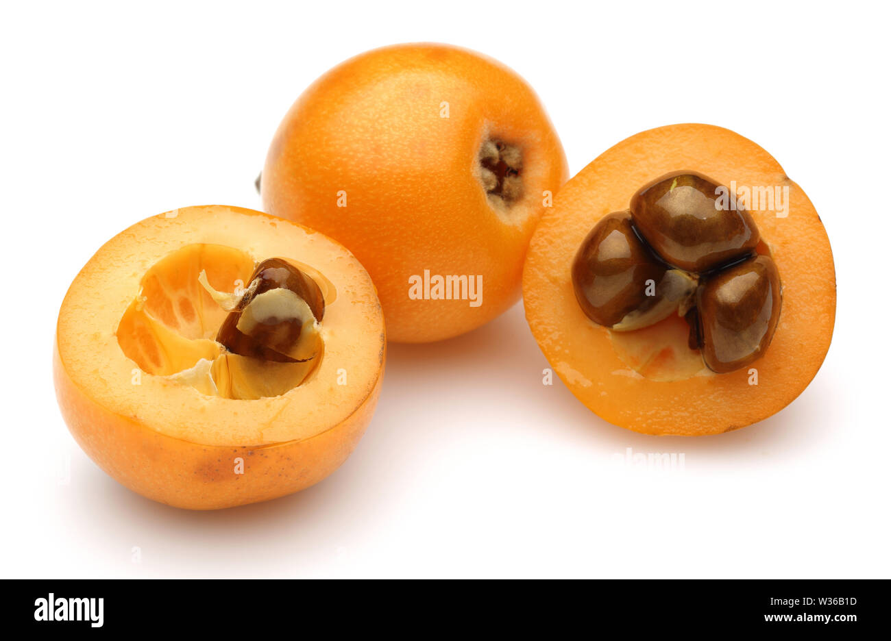 Ripe loquat fruits isolated on white background Stock Photo - Alamy