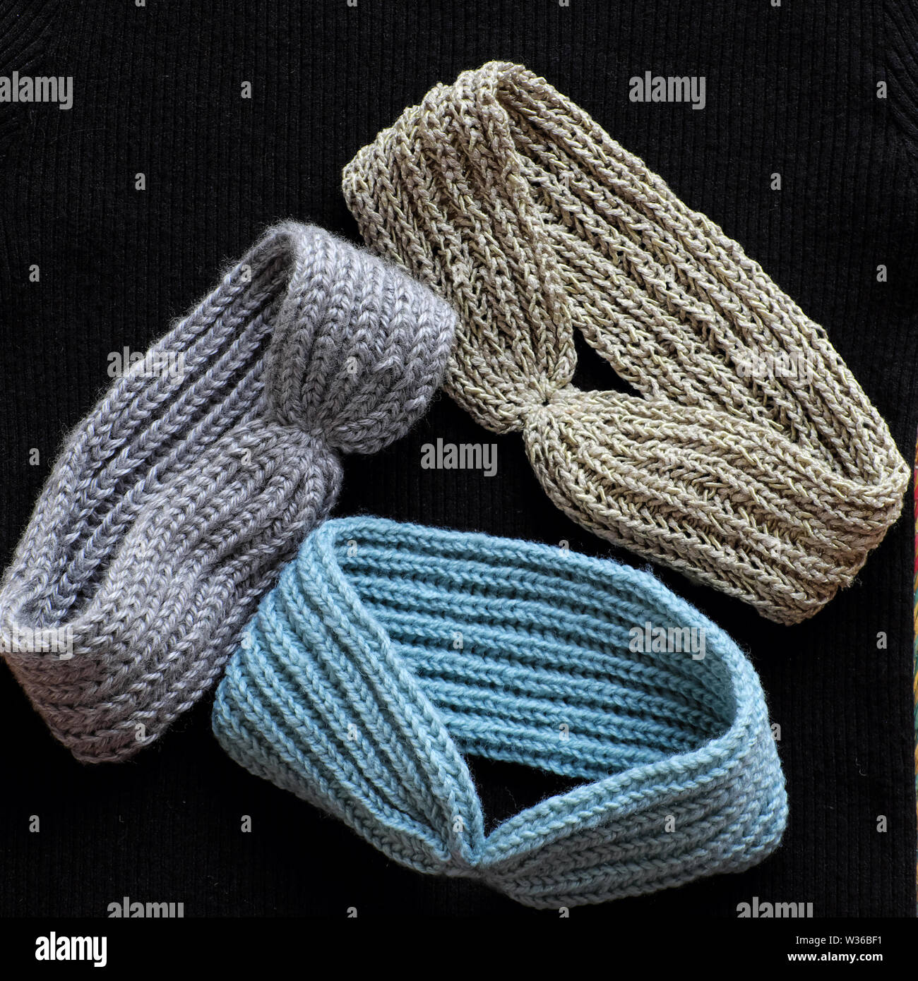 Group of handmade head bands knit in free time as leisure activity at home, accessories for woman from yarn Stock Photo