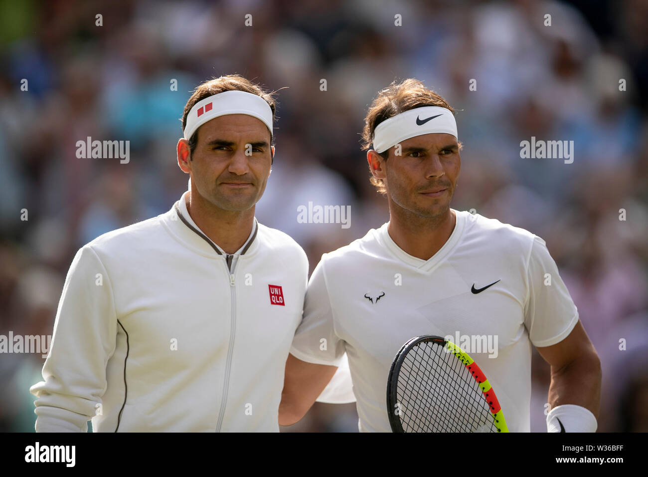 Beijing, Britain. 12th July, 2019. Roger Federer (L) of Switzerland and  Rafael Nadal of Spain pose for a photo before their men's singles semi-final  match at the 2019 Wimbledon Tennis Championships in