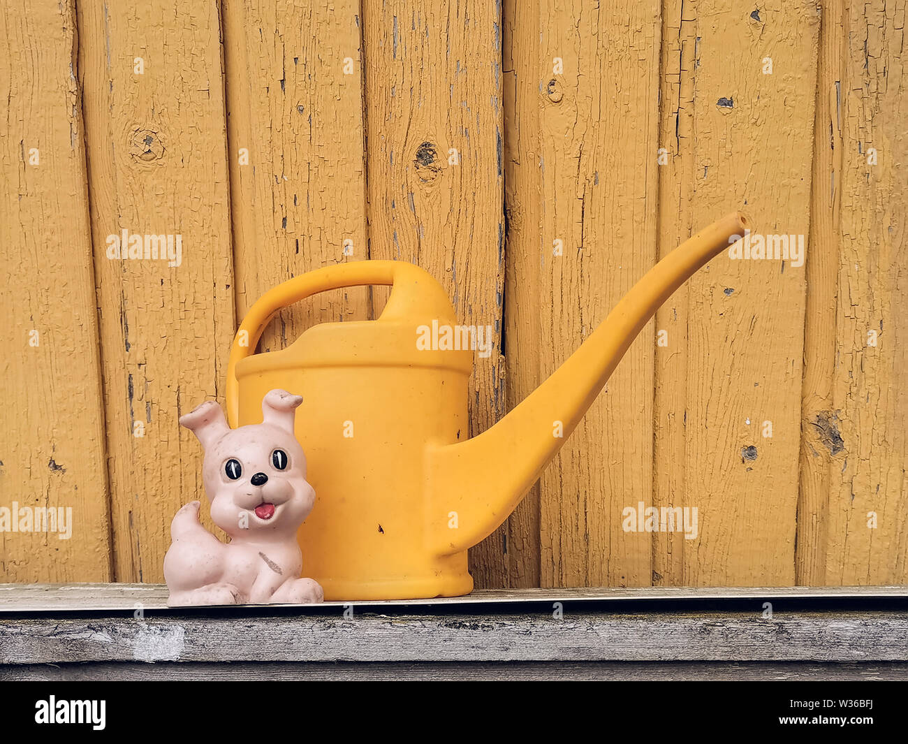 Old retro children's toys: watering can, boat, bunny and monkey. Vintage style Stock Photo