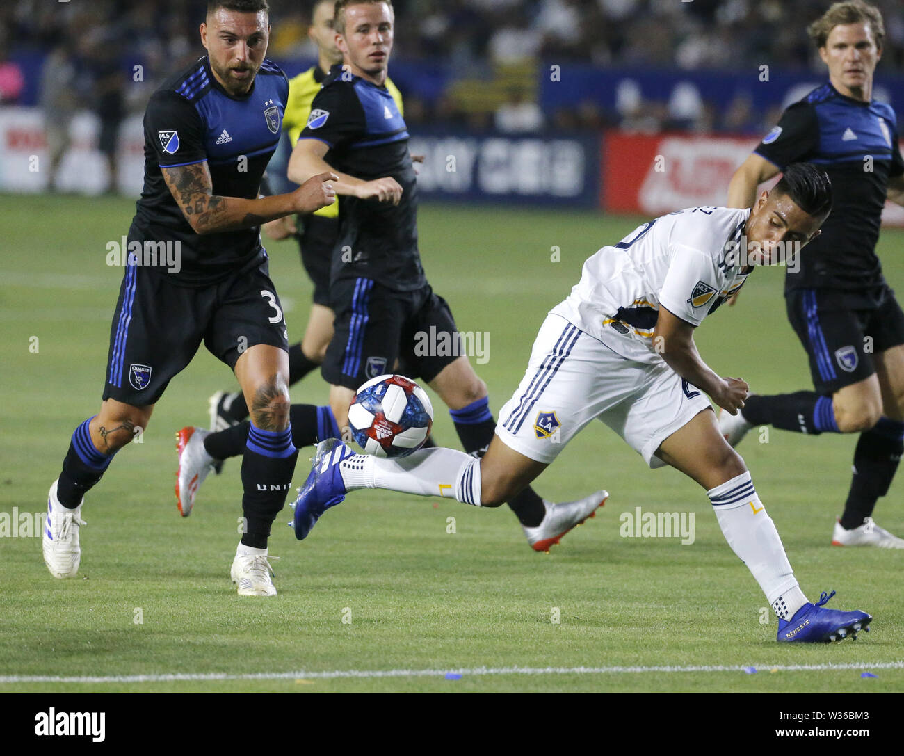 Los Angeles, California, USA. 12th July, 2019. LA Galaxy defender Giancarlo Gonzalez (21) tries to control the ball defended by San Jose Earthquakes defender Guram Kashia (37) during the 2019 Major League Soccer (MLS) match between LA Galaxy and San Jose Earthquakes in Carson, California, July 12, 2019. The Earthquakes won 3-1. Credit: Ringo Chiu/ZUMA Wire/Alamy Live News Stock Photo