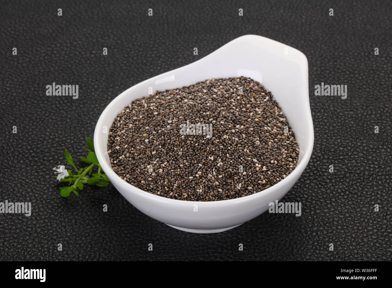 Dietary Chia seeds in the bowl over wooden background Stock Photo - Alamy