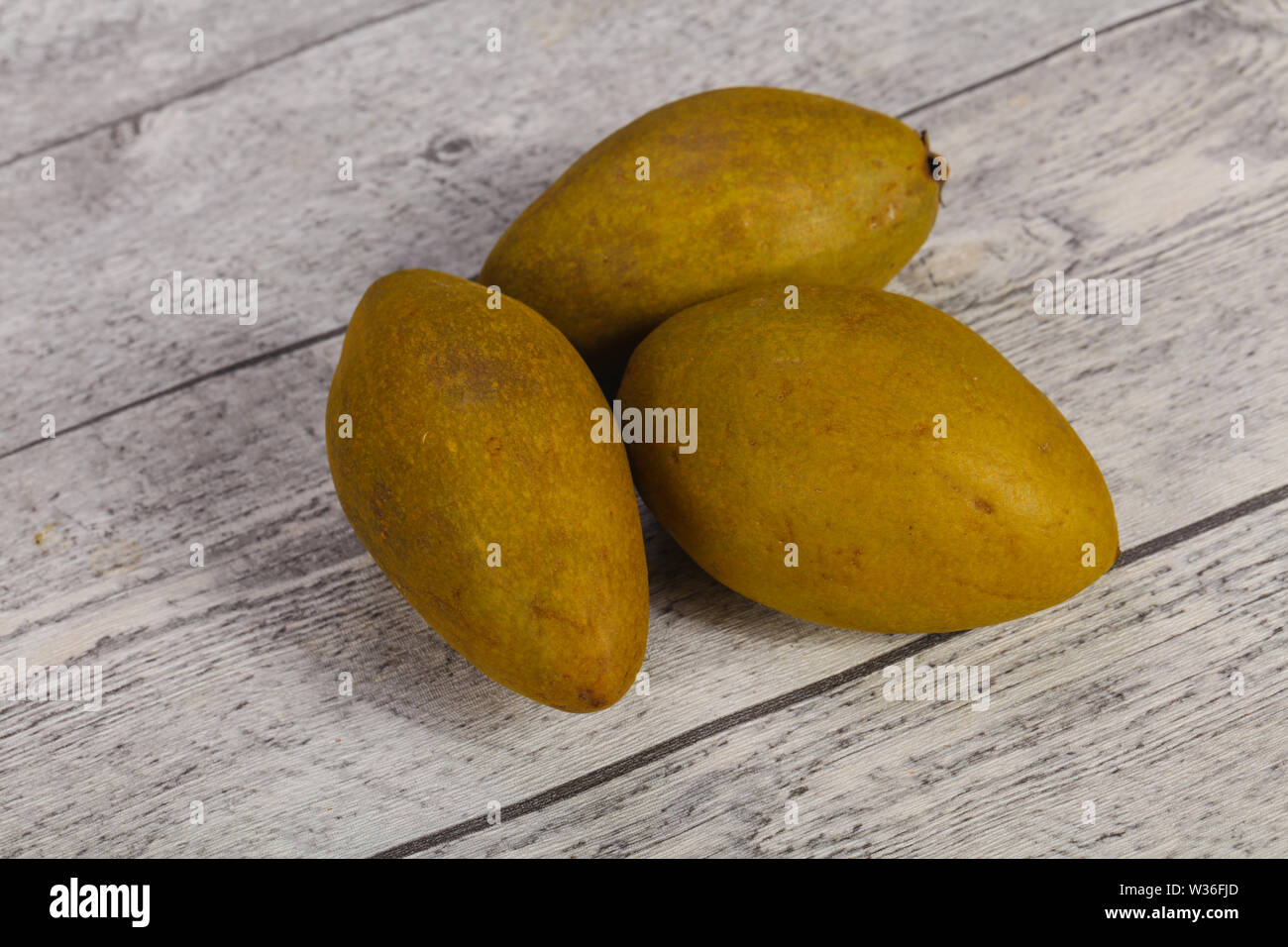 Exotic tropical tasty fruit - Sapodilla in the plate Stock Photo