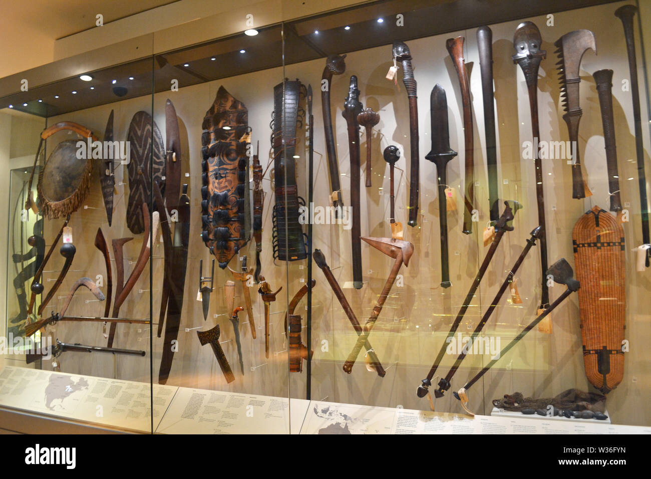 Display of old and tribal weapons at Manchester Museum, UK. Part of the University of Manchester Stock Photo