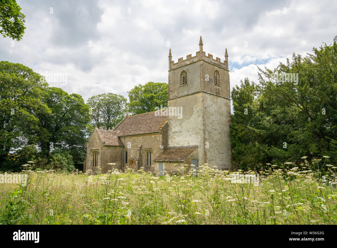 St Mary's Church, Beverston. A Norman church with an original Norman Tower. Beverston is a small Cotswolds village, Gloucestershire, United Kingdom Stock Photo