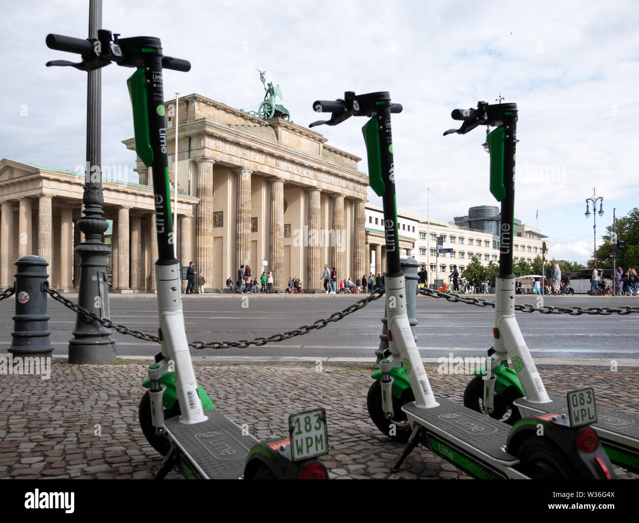 BERLIN, GERMANY - JULY 8, 2019: Motorized Electric Scooters At Brandenburg Gate In Berlin, Germany In Summer Stock Photo
