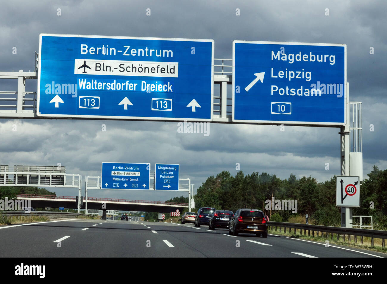 Germany highway sign, traffic multi lane, direction to Berlin, Magdeburg, Leipzig, Potsdam Stock Photo