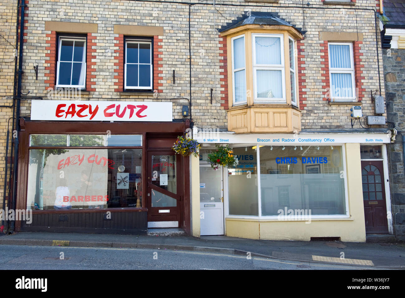 Constituency Office of Brecon & Radnor Conservative MP Chris Davies next to Eazy Cutz barbers in the town centre at Builth Wells Powys Wales UK Stock Photo
