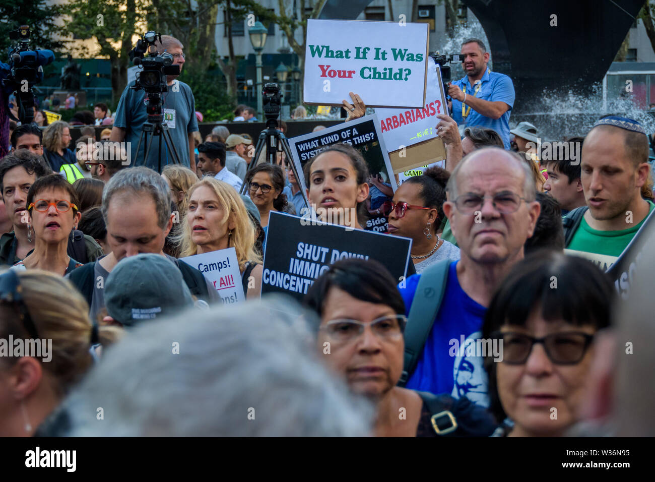 New York, USA. 12th July, 2019. Thousands of advocates, activists and community members flooded the streets at Foley Square, across from the Immigration and Customs Enforcement (ICE) New York Field Office to join New Sanctuary Coalition and The New York Immigration Coalition at the Lights for Liberty vigil, deemed one of the largest solidarity actions in history with over 750 vigils across 5 continents. A light was lit for all those held in U.S. detention camps and to bring light to the darkness of the Trump administration's horrific policies. Credit: ZUMA Press, Inc./Alamy Live News Stock Photo