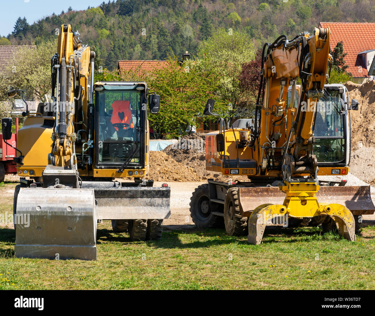 Construction site with yellow excavators Stock Photo - Alamy