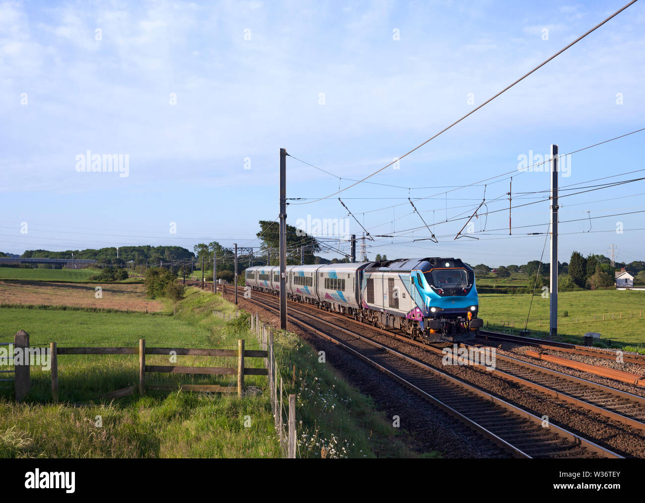 First Transpennine express Nova 3 train with a class 68 and CAF MK 5 carriages passing Morecambe south junction on the west coast main line on test Stock Photo