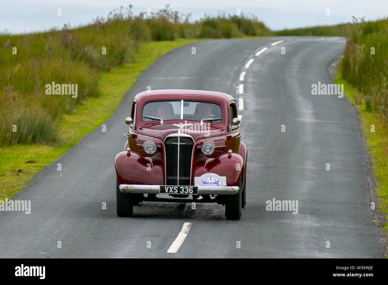 1937 30s Chevrolet maroon coupe at Scorton, Lancashire. Lancashire Car Club Rally Coast to Coast crosses the Trough of Bowland. 74 vintage, classic oldtimers, collectible, heritage, historics vehicles left Morecambe heading for a cross county journey over the Lancashire landscape. Stock Photo