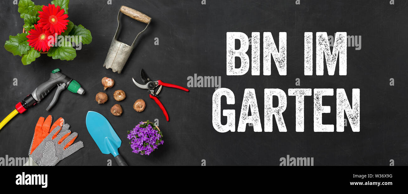 Garden tools on a dark background I am in the garden Bin im Garten (German Stock Photo Alamy
