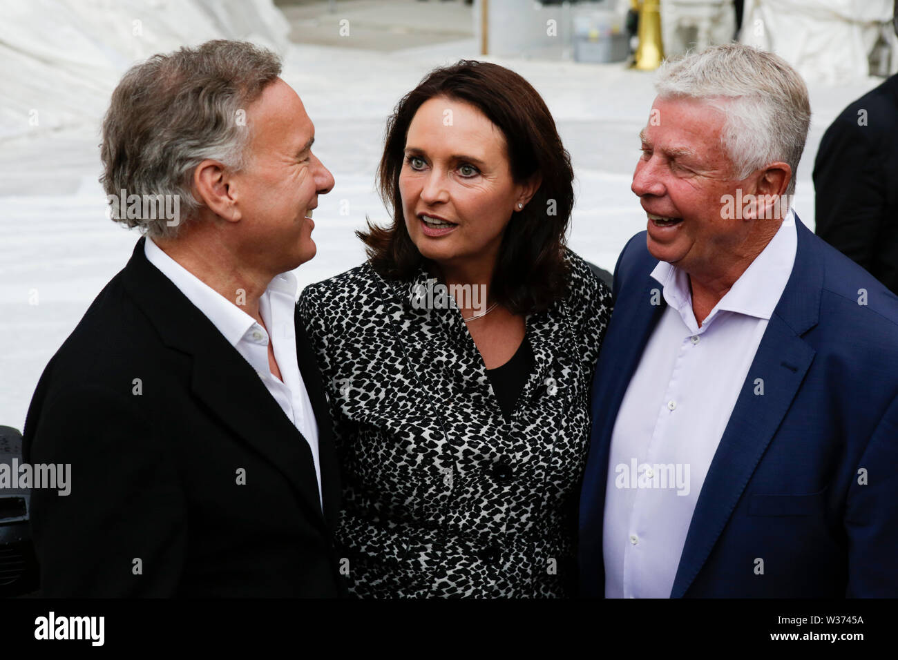 Worms, Germany. 12th July, 2019. Nico Hofmann (left), the intendant of the Nibelungen-Festspiele, Kathrin Anklam-Trapp (centre), a member of the Landtag (parliament) of Rhineland-Palatinate, and the former Lord Mayor of Worms Michael Kissel (right) are pictured before the premiere of the ‘Nibelungen-Festspiele'. Actors, politicians and other VIPs attended the opening night of the 2019 Nibelungen-Festspiele (Nibelung Festival) in Worms. The play in the 18. Season of the festival is called 'Uberwaltigung' (Overcoming) from author Thomas Melle, and directed by Lilja Rupprecht. Credit: PACIFIC PRE Stock Photo