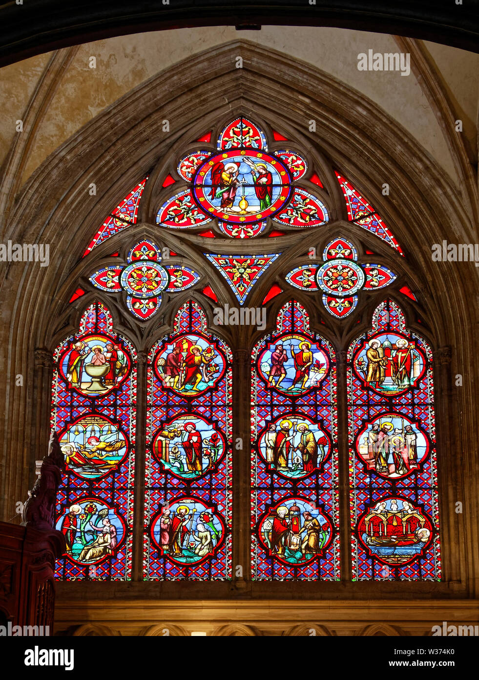 stained glass window, arched, wood inserts, colorful, small medallions, religious art, Notre Dame Cathedral; 1077; medieval; Catholic church; Europe, Stock Photo