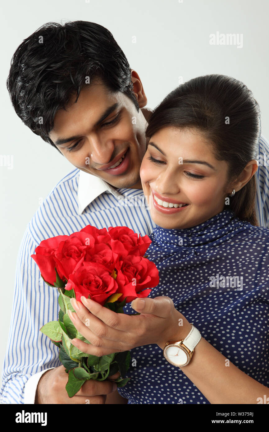 Man giving bunch of flowers to his girlfriend Stock Photo Alamy