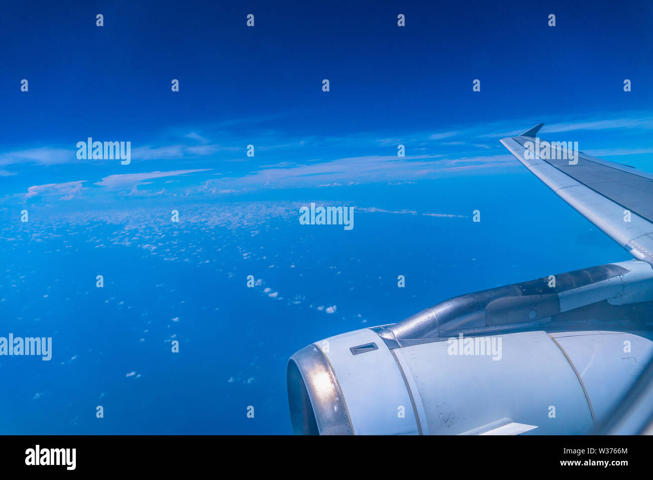 white cloud in blue sky looking from the plane window Stock Photo - Alamy