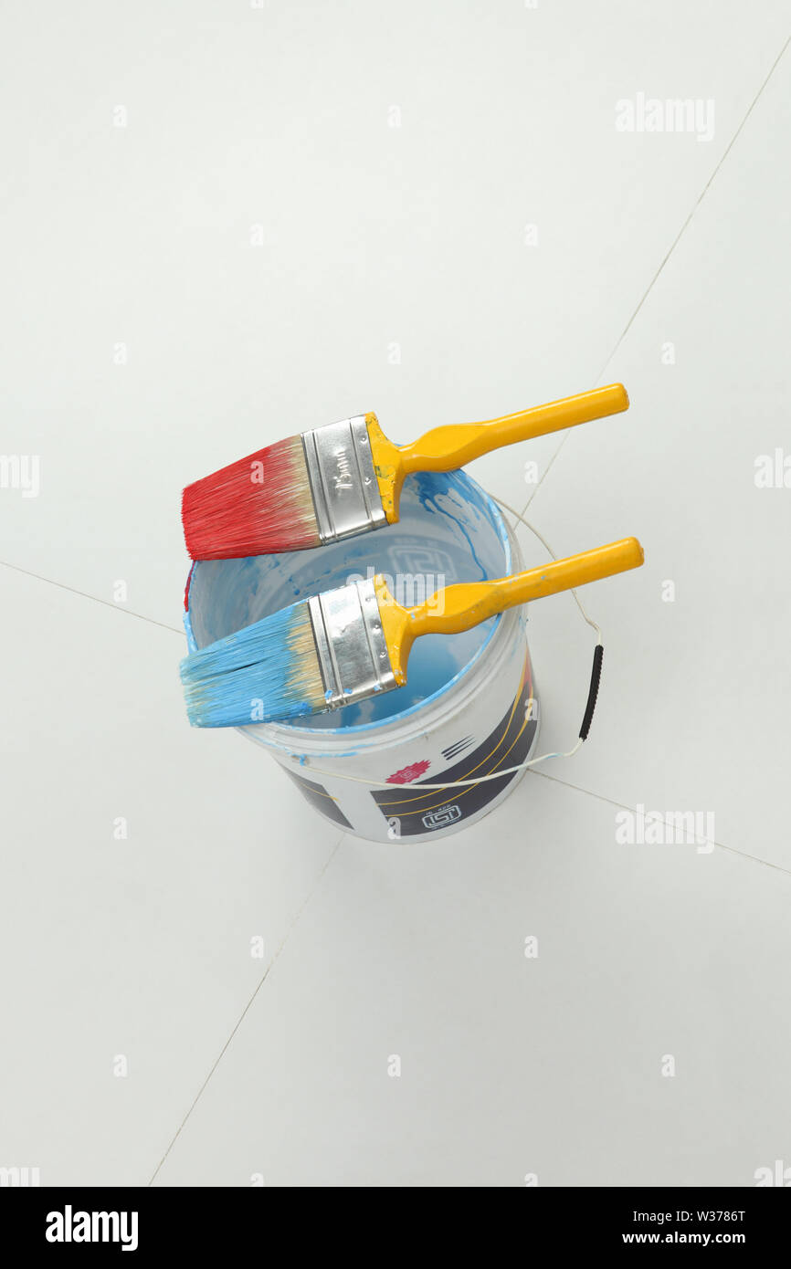 High angle view of open paint can with paintbrushes Stock Photo