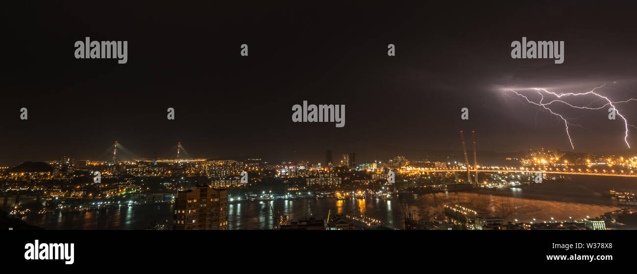Lightning storm over city Stock Photo - Alamy