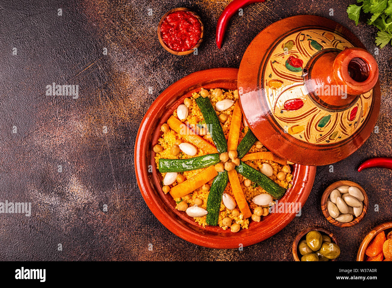Vegetable tagine with almond and chickpea couscous, top view Stock