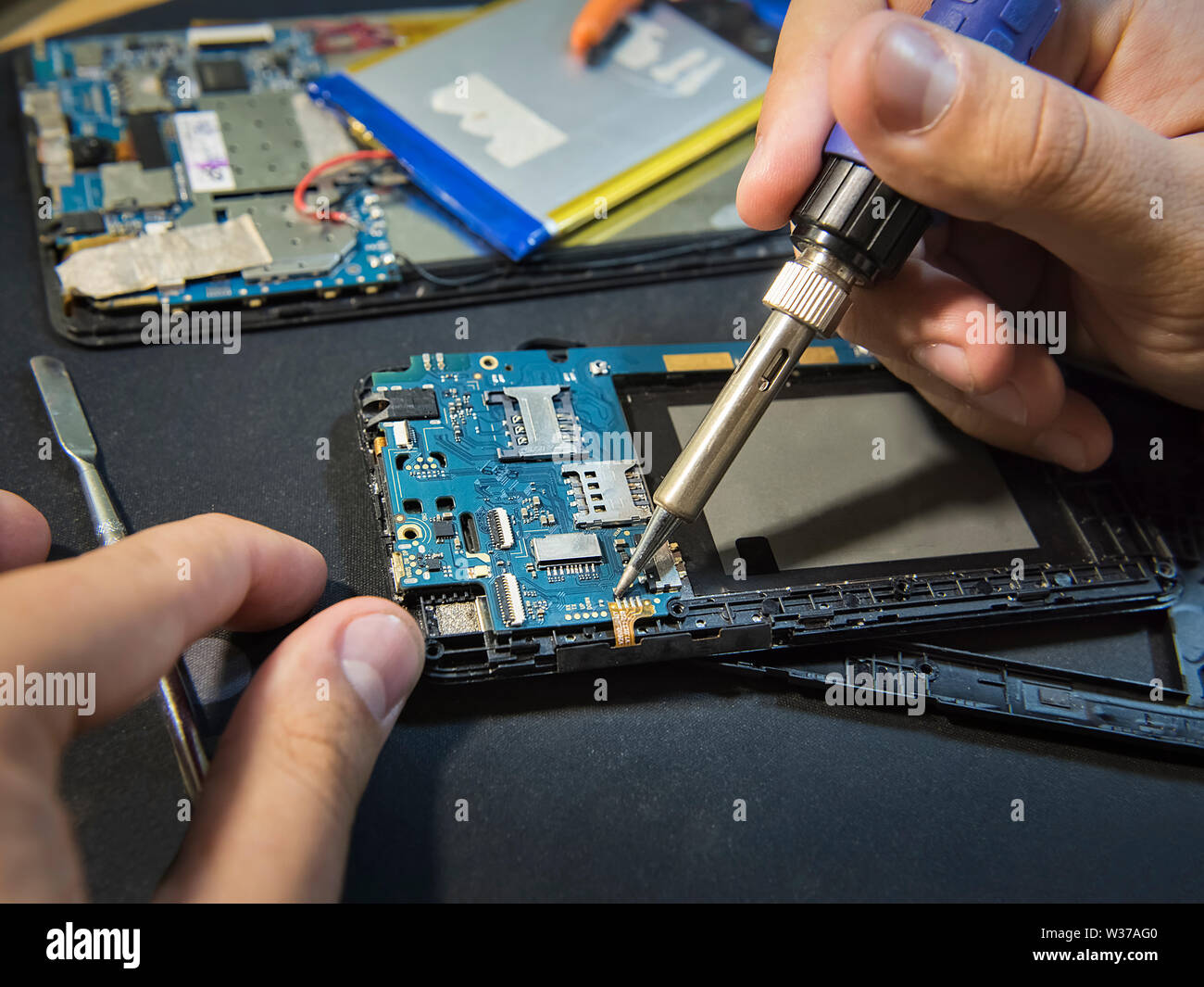 Repair smartphone closeup. Solder connector Stock Photo Alamy