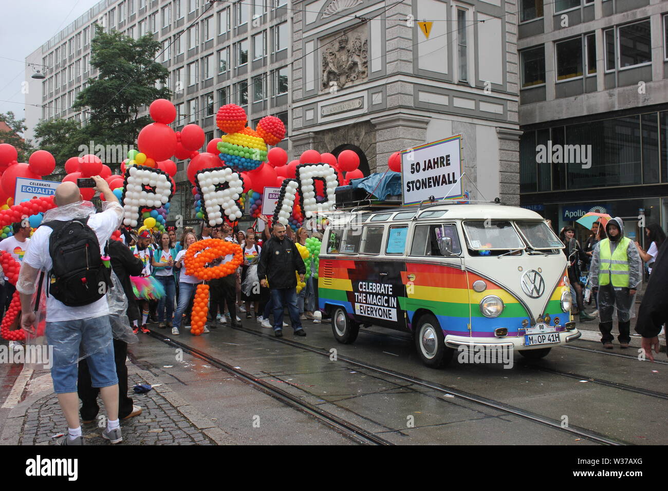 CSD Parade Munich, LGBT community with VW Bully in rainbow colors