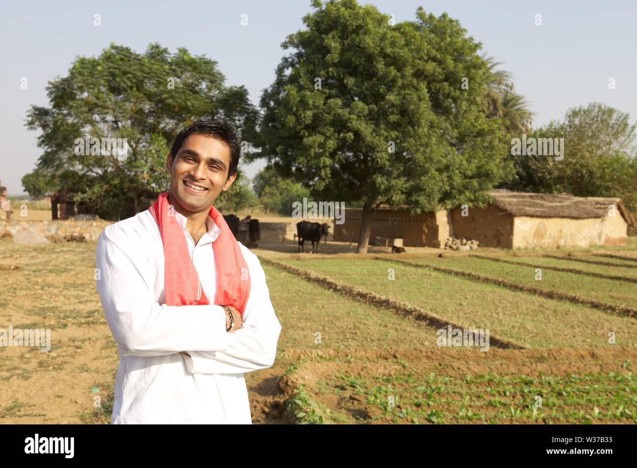 Portrait of a farmer smiling in a field Stock Photo - Alamy