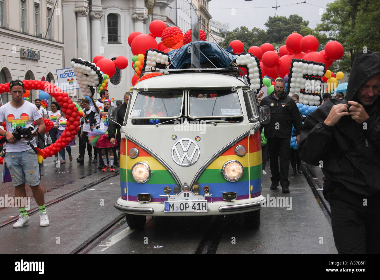 CSD parade, LGBT community, Munich 2019, VW Bully in the rainbow colors. Stock Photo