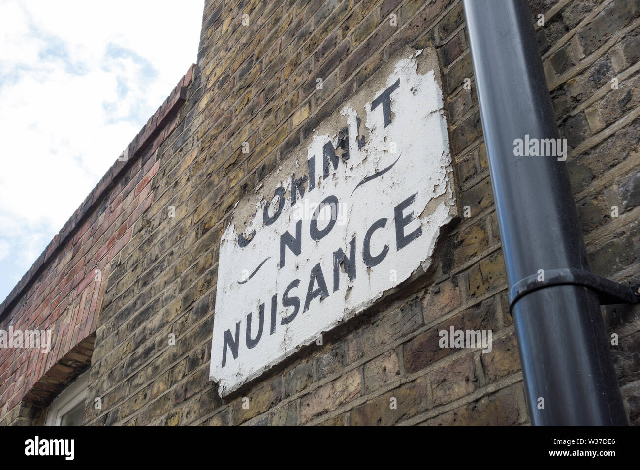 A Victorian 'Commit no nuisance' street sign in Doyce Street, London, SE1, UK Stock Photo