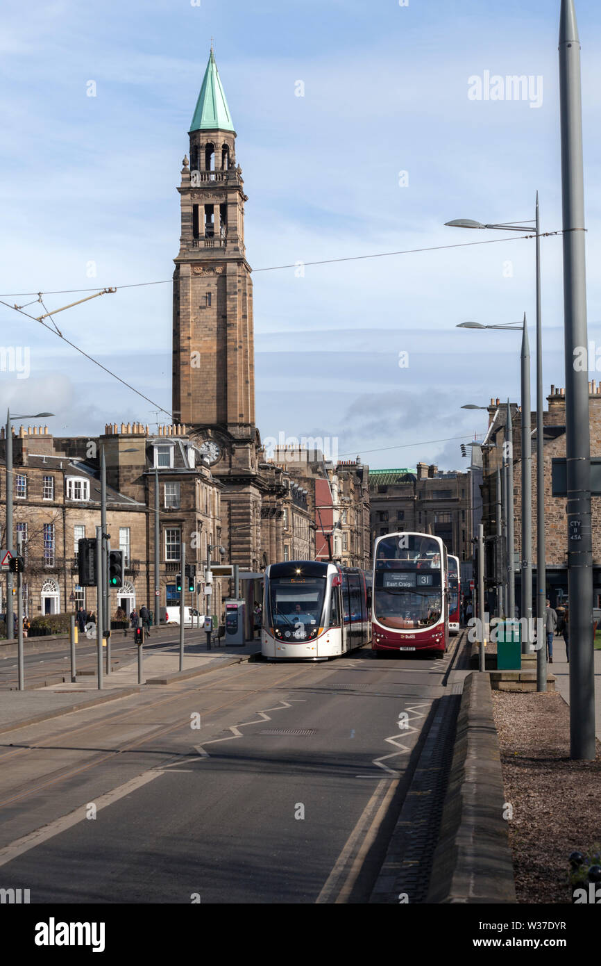 Lothian buses bus alongside Edinburgh tram 265 at West end  Princes street, tram was working a York Place - Edinburgh Airport service Stock Photo