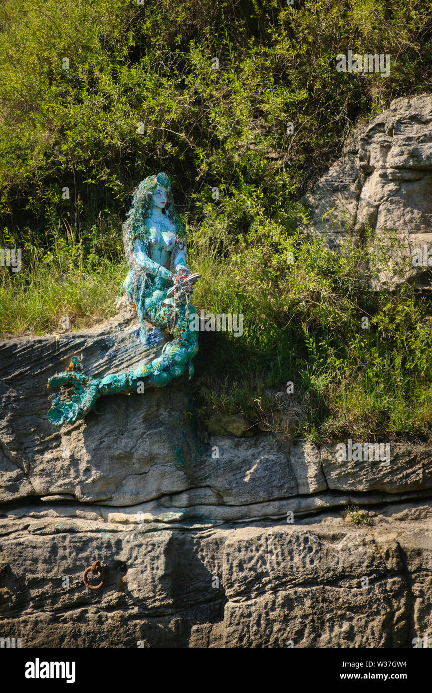 Mermaid sculpture made from driftwood and other flotsam and jetsam  in Seaton Sluice, Northumberland Stock Photo